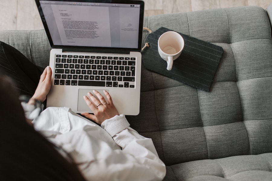 woman using laptop important qualities of a successful freelance writer